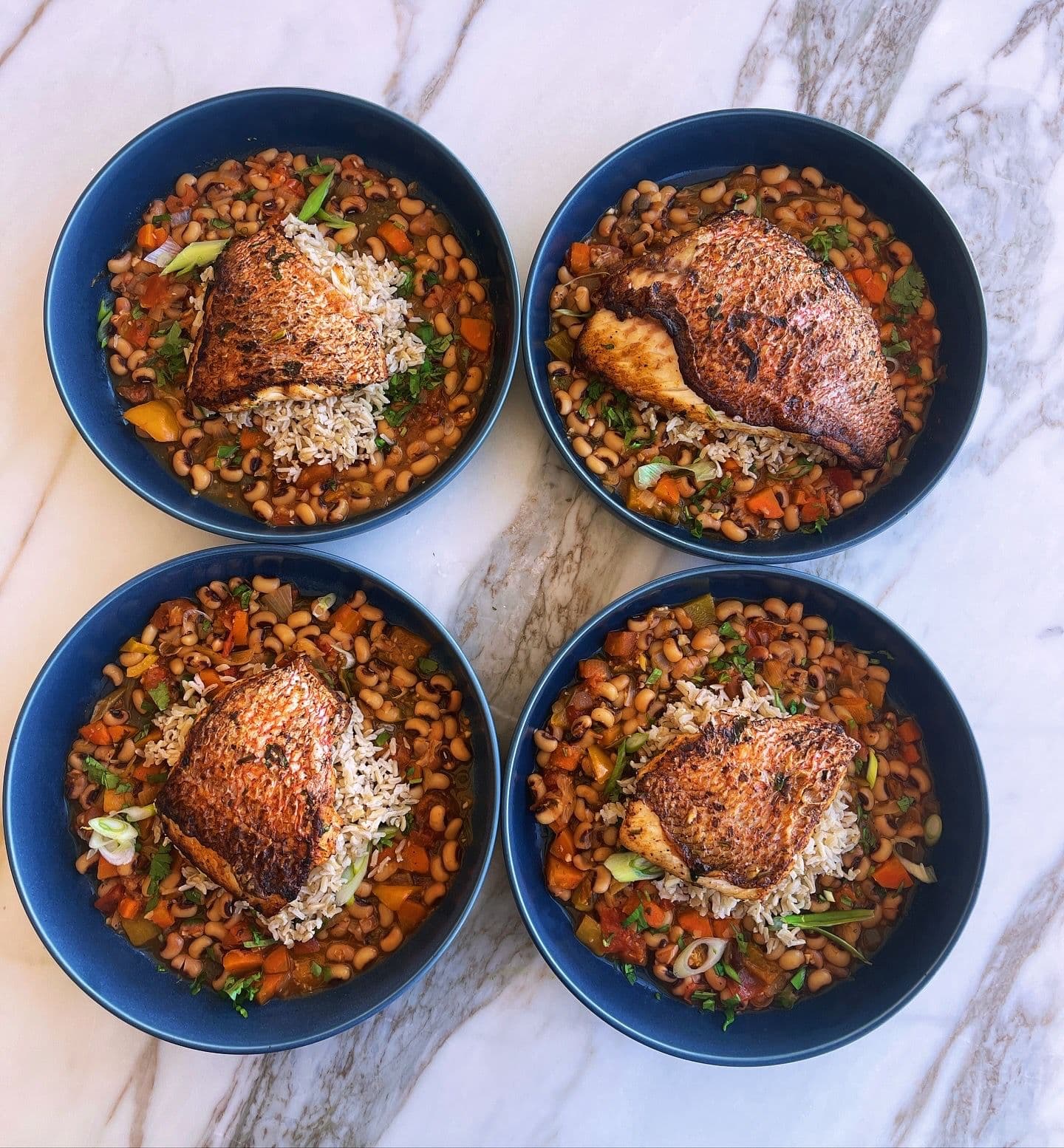 Red snapper with black eye peas over rice