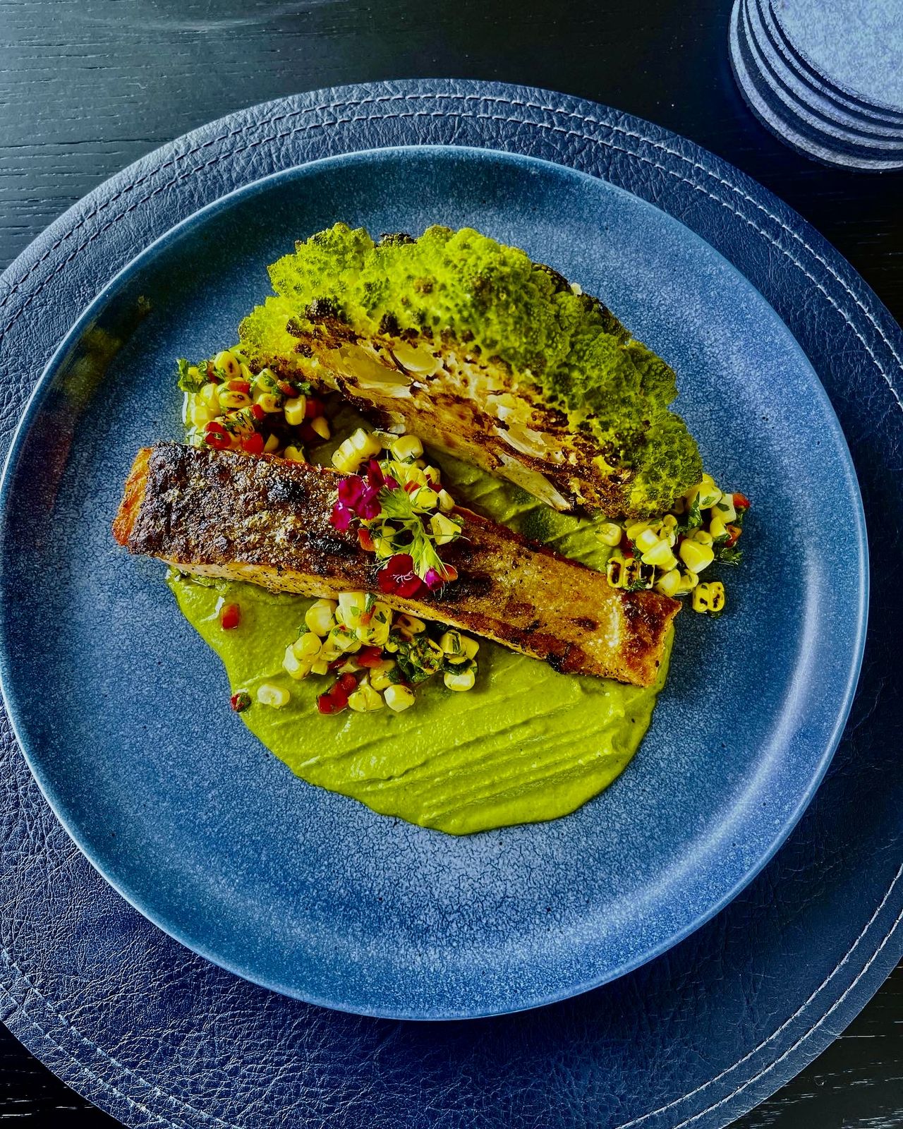 Seared salmon with romanesco, herb purée & corn relish