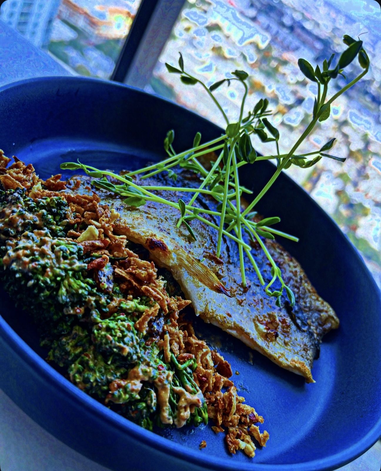 Rainbow trout with broccolini salad, chipotle dressing & crispy onion