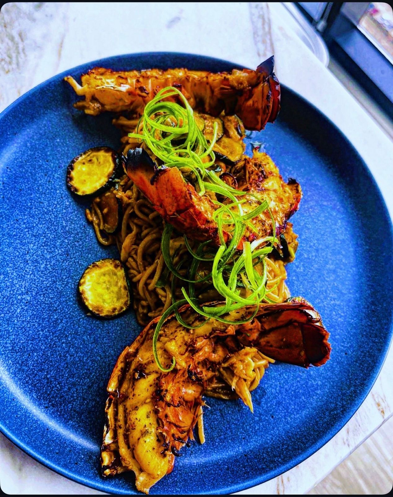 Teriyaki lobster with zucchini & garlic noodles